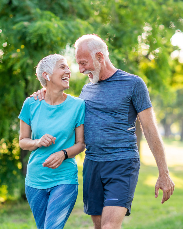 Happy older couple enjoying a walk outside